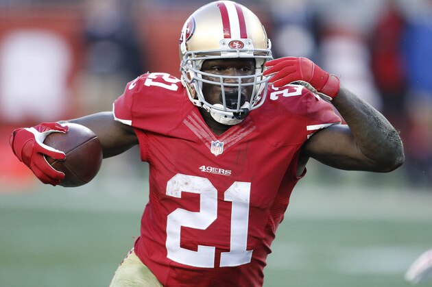 San Francisco 49ers running back Frank Gore (21) runs against the Arizona Cardinals during the fourth quarter of an NFL football game in Santa Clara, Calif., Sunday, Dec. 28, 2014. (AP Photo/Tony Avelar)