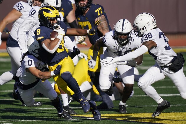 Michigan running back Chris Evans (9) rushes during the first half of an NCAA college football game against Penn State, Saturday, Nov. 28, 2020, in Ann Arbor, Mich. (AP Photo/Carlos Osorio)