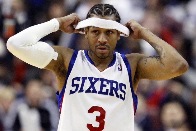 FILE - In this Jan. 25, 2010, file photo, Philadelphia 76ers' Allen Iverson adjusts his head band during an NBA basketball game against the Indiana Pacers, in Philadelphia. Another NBA season opens, with bright lights shining in Boston and the Lakers adding to their ring collection. Meanwhile, one former MVP might be checking his passport status. Iverson appears headed for Turkey, an inglorious end to a great career.  (AP Photo/Matt Slocum, File)