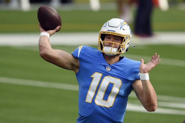 Los Angeles Chargers quarterback Justin Herbert warms up before an NFL football game against the Denver Broncos Sunday, Dec. 27, 2020, in Inglewood, Calif. (AP Photo/Kelvin Kuo)