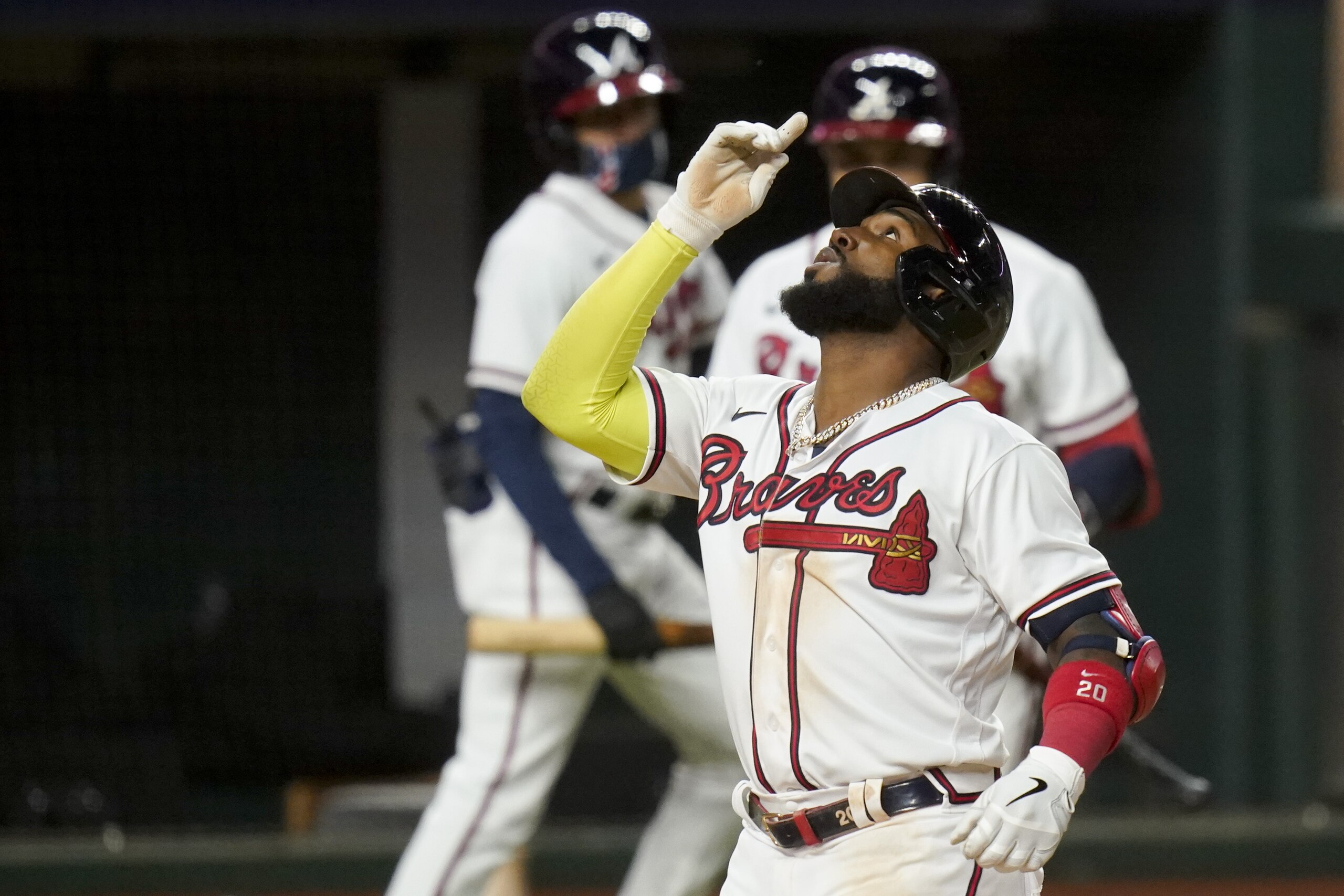 Atlanta Braves' Marcell Ozuna celebrates a home run against the Los Angeles Dodgers during the seventh inning in Game 4 of a baseball National League Championship Series Thursday, Oct. 15, 2020, in Arlington, Texas. (AP Photo/Eric Gay)