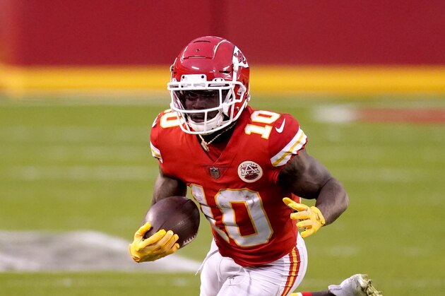 Kansas City Chiefs Tyreek Hill runs the ball during the second half of an NFL divisional round football game against the Cleveland Browns Sunday, Jan. 17, 2021, in Kansas City, Mo. (AP Photo/Charlie Riedel)