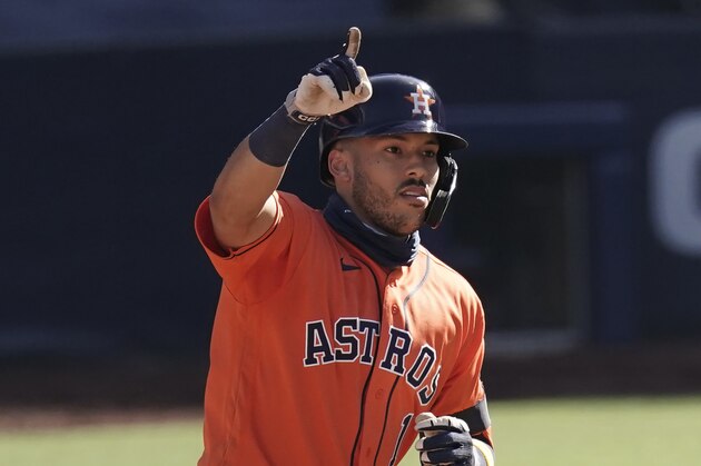 Houston Astros Carlos Correa celebrates after hitting a solo home run Tampa Bay Rays relief pitcher Peter Fairbanks during the sixth inning in Game 2 of a baseball American League Championship Series, Monday, Oct. 12, 2020, in San Diego. (AP Photo/Jae C. Hong)
