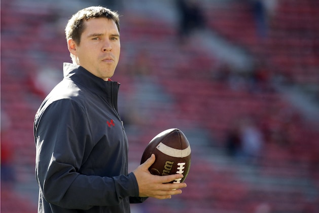 FILE - In this Sept. 9, 2017, file photo, Wisconsin defensive coordinator Jim Leonhard holds a football before an NCAA college football game against Florida Atlantic in Madison, Wis. As lopsided matchups go, No. 4 Wisconsin’s season opener against Western Kentucky on Friday night could provide at least one interesting storyline. The Badgers’ will debut a young secondary with three new starters against a foe that likes to air it out. (AP Photo/Aaron Gash, File)