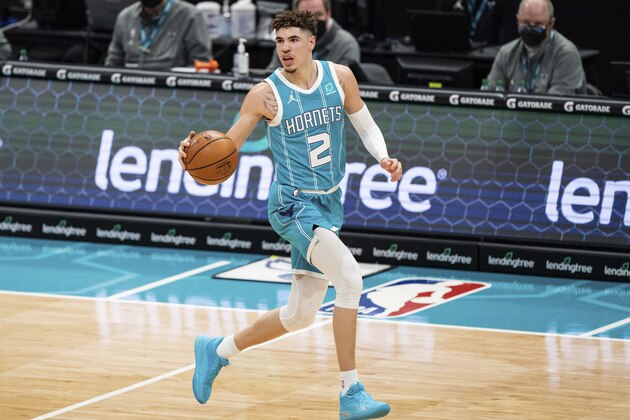 Charlotte Hornets guard LaMelo Ball (2) brings the ball up court against the Utah Jazz during an NBA basketball game in Charlotte, N.C., Friday, Feb. 5, 2021. (AP Photo/Jacob Kupferman)