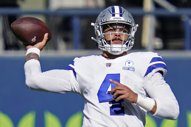 Dallas Cowboys quarterback Dak Prescott passes against the Seattle Seahawks during the first half of an NFL football game, Sunday, Sept. 27, 2020, in Seattle. (AP Photo/Elaine Thompson)