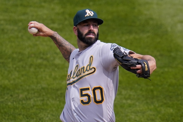 Oakland Athletics starting pitcher Mike Fiers (50) throws against the Colorado Rockies during the first inning of a baseball game, Wednesday, Sept. 16, 2020, in Denver. (AP Photo/Jack Dempsey)