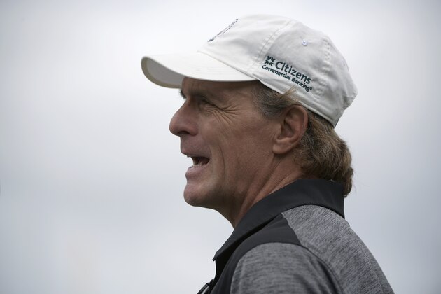 Former Boston College and NFL quarterback Doug Flutie watches from the Notre Dame sideline during the first half of the Camping World Bowl NCAA college football game against Iowa State Saturday, Dec. 28, 2019, in Orlando, Fla. (AP Photo/Phelan M. Ebenhack)