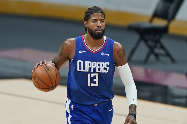 Los Angeles Clippers' Paul George drives in the second half of an NBA basketball game against the Cleveland Cavaliers, Wednesday, Feb. 3, 2021, in Cleveland. (AP Photo/Tony Dejak)