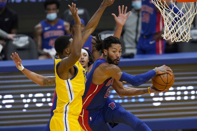 Detroit Pistons guard Derrick Rose, right, passes the ball while defended by Golden State Warriors forward Andrew Wiggins during the first half of an NBA basketball game in San Francisco, Saturday, Jan. 30, 2021. (AP Photo/Jeff Chiu) Detroit Pistons guard Derrick Rose, right, passes the ball while defended by Golden State Warriors forward Andrew Wiggins during the first half of an NBA basketball game in San Francisco, Saturday, Jan. 30, 2021. (AP Photo/Jeff Chiu)
