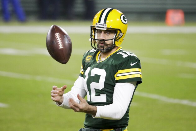 Green Bay Packers' Aaron Rodgers warms up before an NFL football game against the Carolina Panthers Saturday, Dec. 19, 2020, in Green Bay, Wis. (AP Photo/Mike Roemer)