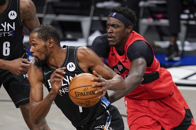 Brooklyn Nets' Kevin Durant, left, drives past Toronto Raptors' Pascal Siakam during the first half of an NBA basketball game Friday, Feb. 5, 2021, in New York. (AP Photo/Frank Franklin II)