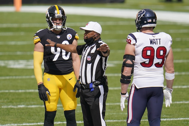 Pittsburgh Steelers outside linebacker T.J. Watt (90) and his brother Houston Texans defensive end J.J. Watt (99) take the coin toss before an NFL football game in Pittsburgh, Sunday, Sept. 27, 2020. (AP Photo/Gene J. Puskar)