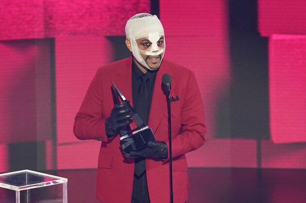 The Weeknd accepts the award for favorite male soul/R&B artist at the American Music Awards on Sunday, Nov. 22, 2020, at the Microsoft Theater in Los Angeles. (AP Photo/Chris Pizzello)