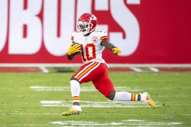 Kansas City Chiefs wide receiver Tyreek Hill (10) runs with the ball against the Tampa Bay Buccaneers during an NFL football game, Sunday, Nov. 29, 2020, in Tampa, Fla. (AP Photo/Doug Murray)