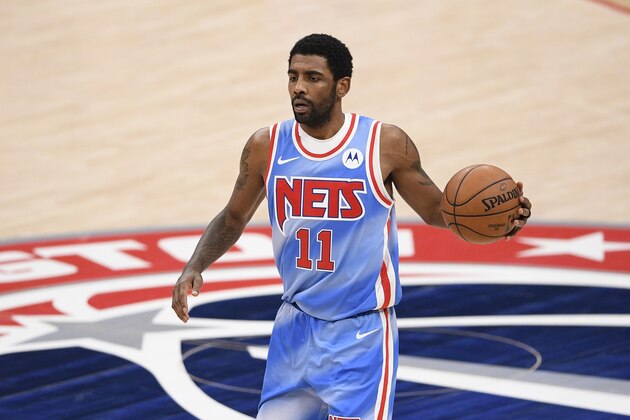 Brooklyn Nets guard Kyrie Irving (11) dribbles the ball during the second half of an NBA basketball game against the Washington Wizards, Sunday, Jan. 31, 2021, in Washington. (AP Photo/Nick Wass) Brooklyn Nets guard Kyrie Irving (11) dribbles the ball during the second half of an NBA basketball game against the Washington Wizards, Sunday, Jan. 31, 2021, in Washington. (AP Photo/Nick Wass)