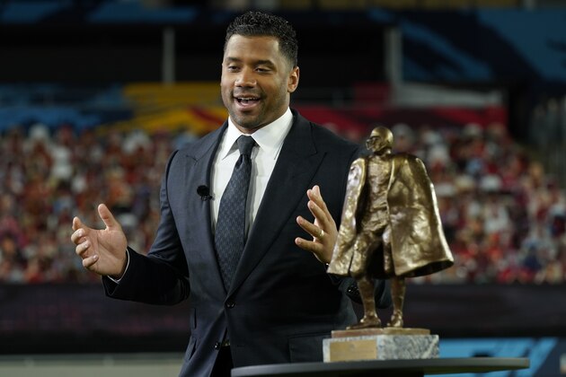 Seattle Seahawks quarterback Russell Wilson speaks after winning the Walter Payton NFL Man of the Year awards at the NFL Honors ceremony as part of Super Bowl 55 Friday, Feb. 5, 2021, in Tampa, Fla. (AP Photo/Charlie Riedel)