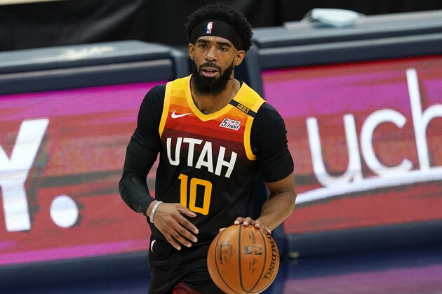 Utah Jazz guard Mike Conley (10) in the first half of an NBA basketball game Sunday, Jan. 31, 2021, in Denver. (AP Photo/David Zalubowski)