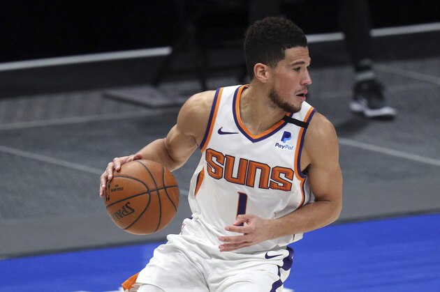 Phoenix Suns guard Devin Booker (1) is seen during an NBA basketball game against the Dallas Mavericks, Monday, Feb. 1, 2021, in Dallas. (AP Photo/ Richard W. Rodriguez)