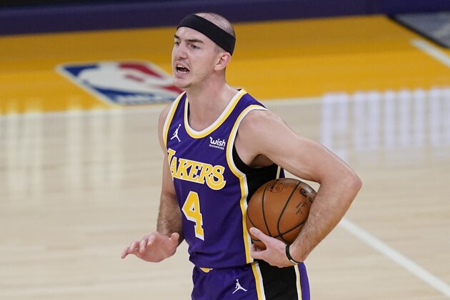 Los Angeles Lakers guard Alex Caruso (4) controls the ball during the first quarter of an NBA basketball game against the New Orleans Pelicans Friday, Jan. 15, 2021, in Los Angeles. (AP Photo/Ashley Landis)