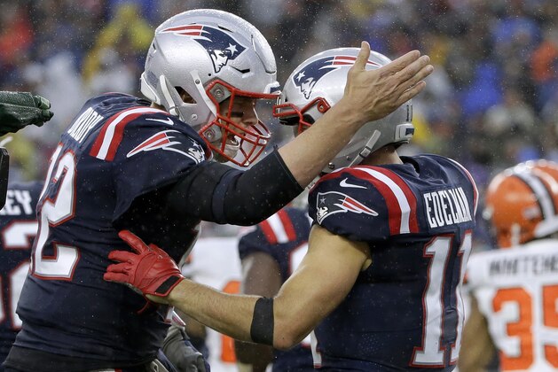 New England Patriots quarterback Tom Brady, left, celebrates his touchdown pass to Julian Edelman, right, in the first half of an NFL football game against the Cleveland Browns, Sunday, Oct. 27, 2019, in Foxborough, Mass. (AP Photo/Steven Senne)