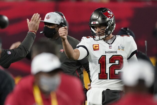 Tampa Bay Buccaneers quarterback Tom Brady celebrates after his team scored a touchdown against the Kansas City Chiefs during the first half of the NFL Super Bowl 55 football game Sunday, Feb. 7, 2021, in Tampa, Fla. (AP Photo/Ashley Landis)