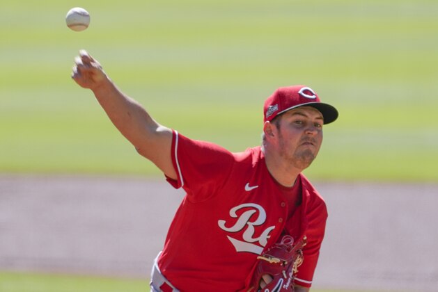Cincinnati Reds starting pitcher Trevor Bauer (27) delievers in first inning against the Atlanta Braves during Game 1 of a National League wild-card baseball series, Wednesday, Sept. 30, 2020, in Atlanta. (AP Photo/John Bazemore)