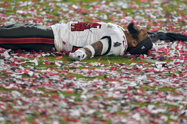 Tampa Bay Buccaneers cornerback Carlton Davis celebrates on the field after their NFL Super Bowl 55 football game against the Kansas City Chiefs, Sunday, Feb. 7, 2021, in Tampa, Fla. The Buccaneers defeated the Chiefs 31-9 to win the Super Bowl. (AP Photo/Gregory Bull)