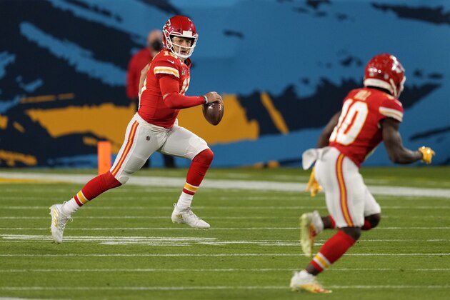 Kansas City Chiefs quarterback Patrick Mahomes, left, along side Tyreek Hill, right, in the first half of the NFL Super Bowl 55 football game against the Tampa Bay Buccaneers Sunday, Feb. 7, 2021, in Tampa, Fla. (AP Photo/Chris O'Meara)