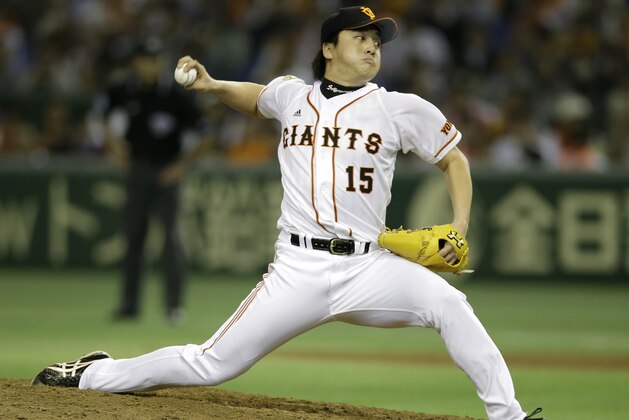 Yomiuri Giants pitcher Hirokazu Sawamura delivers a pitch against the Rakuten Eagles in the sixth inning of Game 4 of baseball's Japan Series at Tokyo Dome in Tokyo, Wednesday, Oct. 30, 2013. (AP Photo/Toru Takahashi)