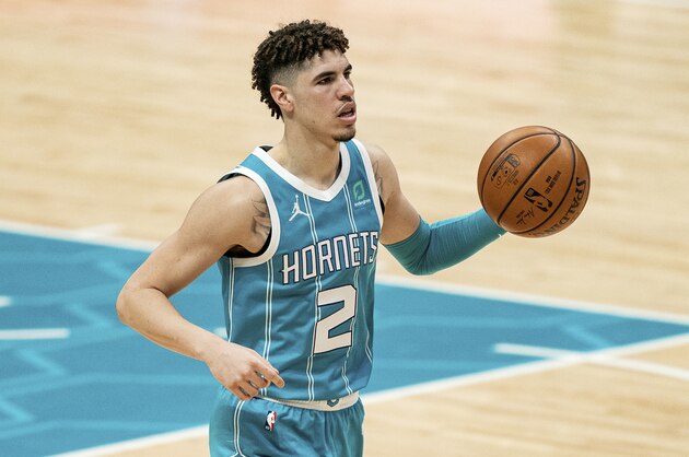 Charlotte Hornets guard LaMelo Ball (2) brings the ball up court against the Washington Wizards during an NBA basketball game in Charlotte, N.C., Sunday, Feb. 7, 2021. (AP Photo/Jacob Kupferman)