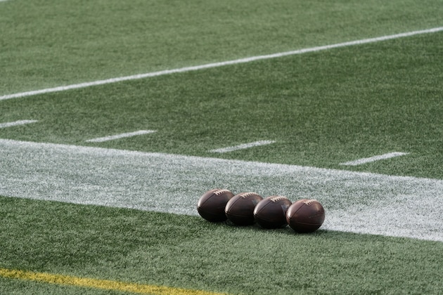 Footballs are pictured on the field before an NFL football game between the Seattle Seahawks and the Los Angeles Rams, Sunday, Dec. 27, 2020, in Seattle. The Seahawks won 20-9. (AP Photo/Stephen Brashear)