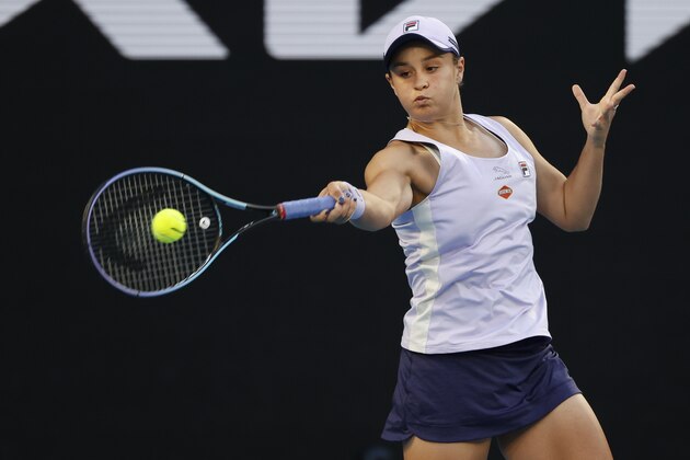 Australia's Ashleigh Barty makes a forehand return to Montenegrin's Danke Kovinic during their first round match at the Australian Open tennis championship in Melbourne, Australia, Tuesday, Feb. 9, 2021. (AP Photo/Rick Rycroft)