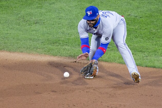 Toronto Blue Jays' Jonathan Villar (20) fields a grounder by Philadelphia Phillies Phil Gosselin during the second inning of a baseball game, Saturday, Sept. 19, 2020, in Philadelphia. (AP Photo/Laurence Kesterson)