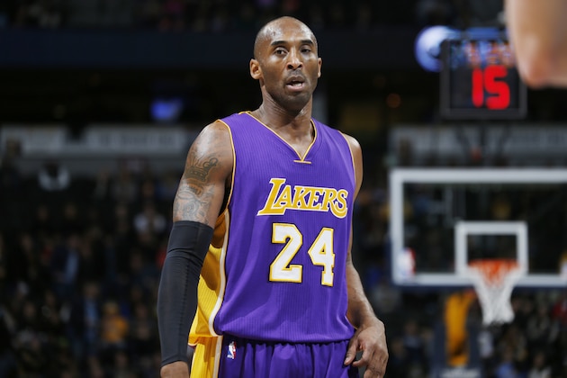 Los Angeles Lakers guard Kobe Bryant looks on against the Denver Nuggets in the first quarter of an NBA basketball game Tuesday, Dec. 30, 2014, in Denver. (AP Photo/David Zalubowski)