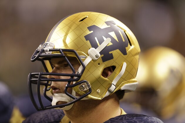 A logo is shown on the helmet of Notre Dame offensive linesman Sam Bush during the first half of an NCAA college football game against Purdue in Indianapolis, Saturday, Sept. 13, 2014. (AP Photo/Michael Conroy)