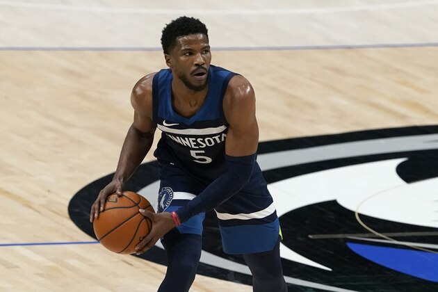 Minnesota Timberwolves' Malik Beasley (5) handles the ball during an NBA preseason basketball game against the Dallas Mavericks in Dallas, Thursday, Dec. 17, 2020. (AP Photo/Tony Gutierrez)