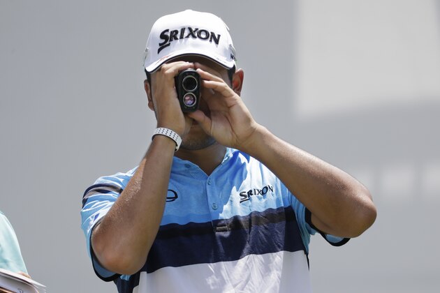 Hideki Matsuyama, of Japan, measures the distance before hitting his drive on the 18th hole during a practice round for the World Golf Championships-FedEx St. Jude Invitational Wednesday, July 24, 2019, in Memphis, Tenn. (AP Photo/Mark Humphrey)