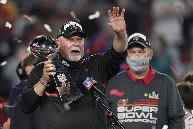 Tampa Bay Buccaneers head coach Bruce Arians holds up the Vince Lombardi trophy after defeating the Kansas City Chiefs in the NFL Super Bowl 55 football game Sunday, Feb. 7, 2021, in Tampa, Fla. The Buccaneers defeated the Chiefs 31-9 to win the Super Bowl. (AP Photo/Ashley Landis)