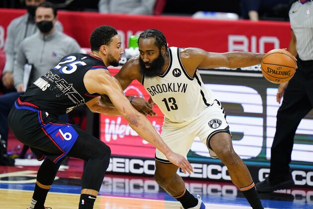 Brooklyn Nets' James Harden (13) tries to drive past Philadelphia 76ers' Ben Simmons (25) during the second half of an NBA basketball game, Saturday, Feb. 6, 2021, in Philadelphia. (AP Photo/Matt Slocum)