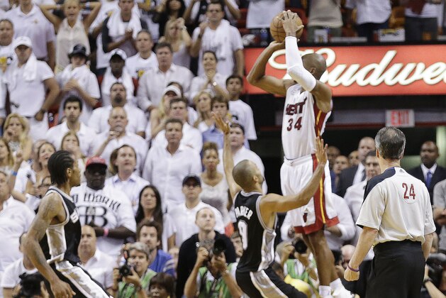 Miami Heat shooting guard Ray Allen (34) shoots a three-point basket in the end of regulation  during the second half of Game 6 of the NBA Finals basketball game against the San Antonio Spurs, Wednesday, June 19, 2013 in Miami. (AP Photo/Lynne Sladky)