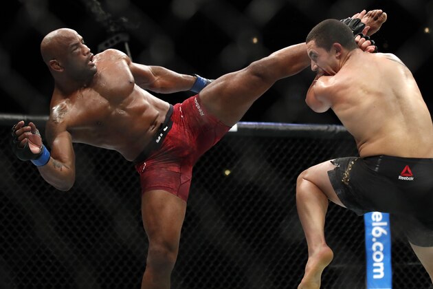 Robert Whittaker, right, and Yoel Romero fight during their middleweight Title bout at the UFC 225 Mixed Martial Arts event Sunday, June 10, 2018, in Chicago. (AP Photo/Jim Young)