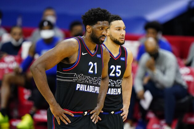 Philadelphia 76ers' Joel Embiid and Ben Simmons talk during an NBA basketball game against the Brooklyn Nets, Saturday, Feb. 6, 2021, in Philadelphia. (AP Photo/Matt Slocum)