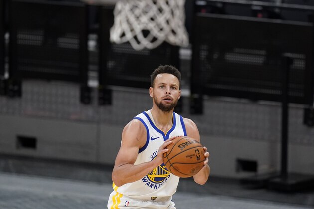 Golden State Warriors guard Stephen Curry (30) shoots against the San Antonio Spurs during the second half of an NBA basketball game in San Antonio, Tuesday, Feb. 9, 2021. (AP Photo/Eric Gay)