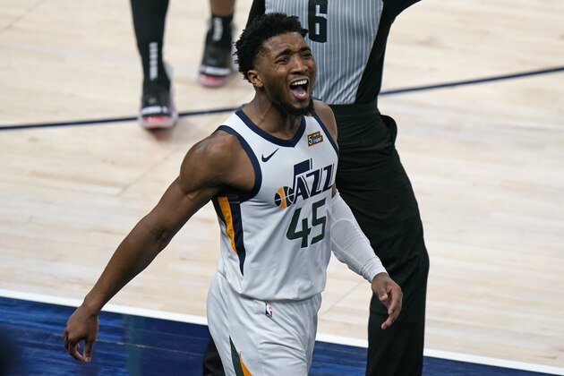 Utah Jazz guard Donovan Mitchell (45) reacts after scoring against the Boston Celtics in the second half during an NBA basketball game Tuesday, Feb. 9, 2021, in Salt Lake City. (AP Photo/Rick Bowmer)