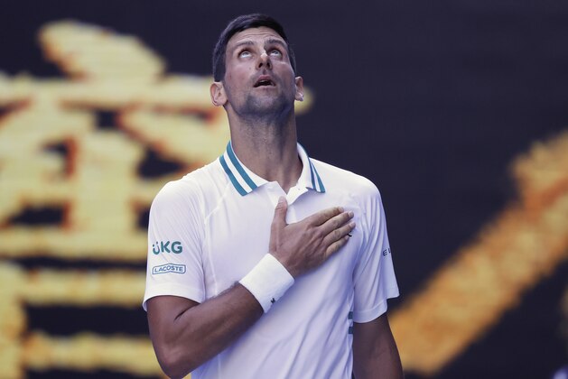 Serbia's Novak Djokovic celebrates after defeating United States' Frances Tiafoe in their second round match at the Australian Open tennis championship in Melbourne, Australia, Wednesday, Feb. 10, 2021.(AP Photo/Rick Rycroft)