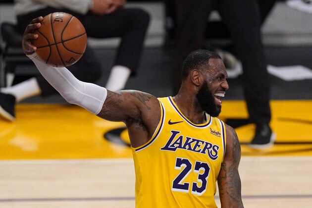 Los Angeles Lakers forward LeBron James jokes around during the overtime period of an NBA basketball game against the Oklahoma City Thunder Monday, Feb. 8, 2021, in Los Angeles. The Lakers won 119-112 in overtime. (AP Photo/Mark J. Terrill)