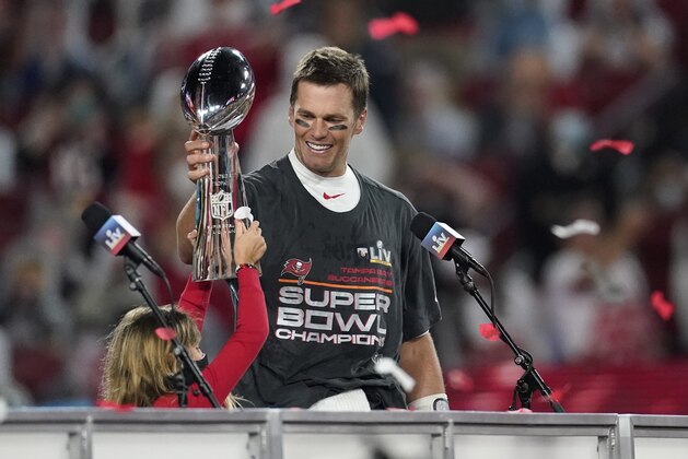 Tampa Bay Buccaneers quarterback Tom Brady holds up the Vince Lombardi trophy after defeating the Kansas City Chiefs in the NFL Super Bowl 55 football game Sunday, Feb. 7, 2021, in Tampa, Fla. The Buccaneers defeated the Chiefs 31-9 to win the Super Bowl. (AP Photo/Ashley Landis)