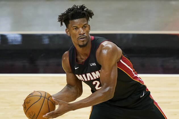 Miami Heat forward Jimmy Butler (22) looks to pass the pass during the second half of an NBA basketball game against the Washington Wizards, Friday, Feb. 5, 2021, in Miami. (AP Photo/Marta Lavandier)