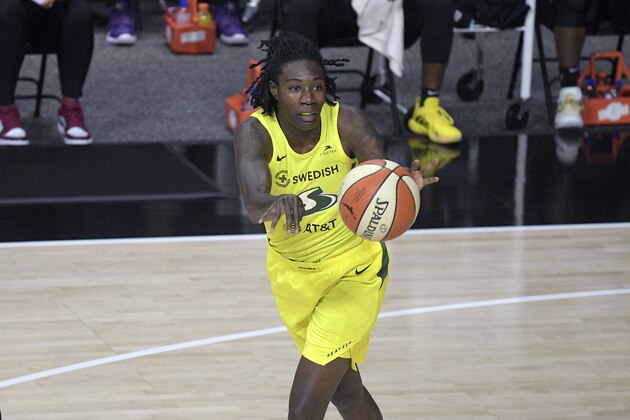 Seattle Storm forward Natasha Howard passes the ball during the first half of a WNBA basketball game against the New York Liberty, Tuesday, Aug. 18, 2020, in Bradenton, Fla. (AP Photo/Phelan M. Ebenhack)